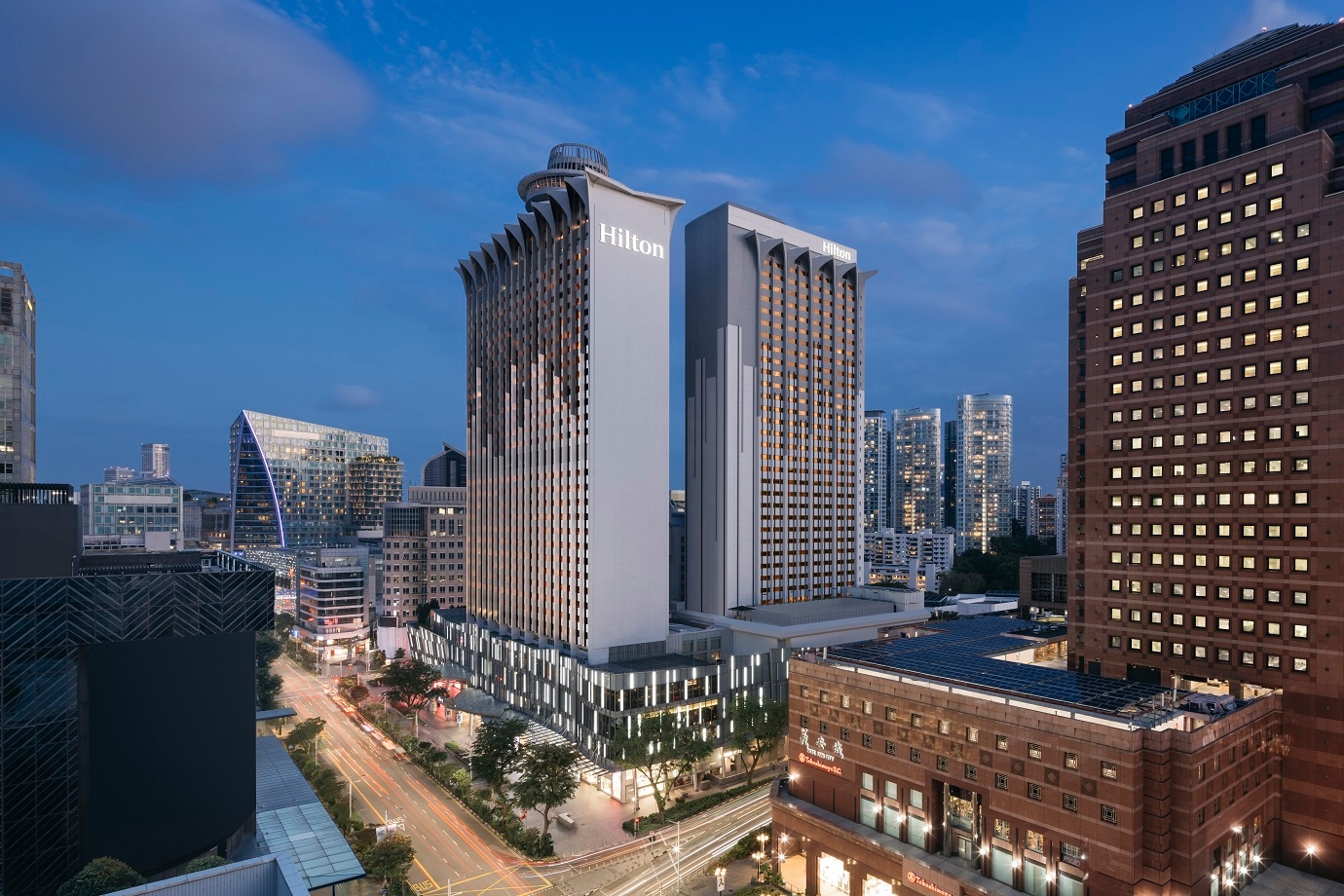 The exterior of Hilton Singapore Orchard in the evening.