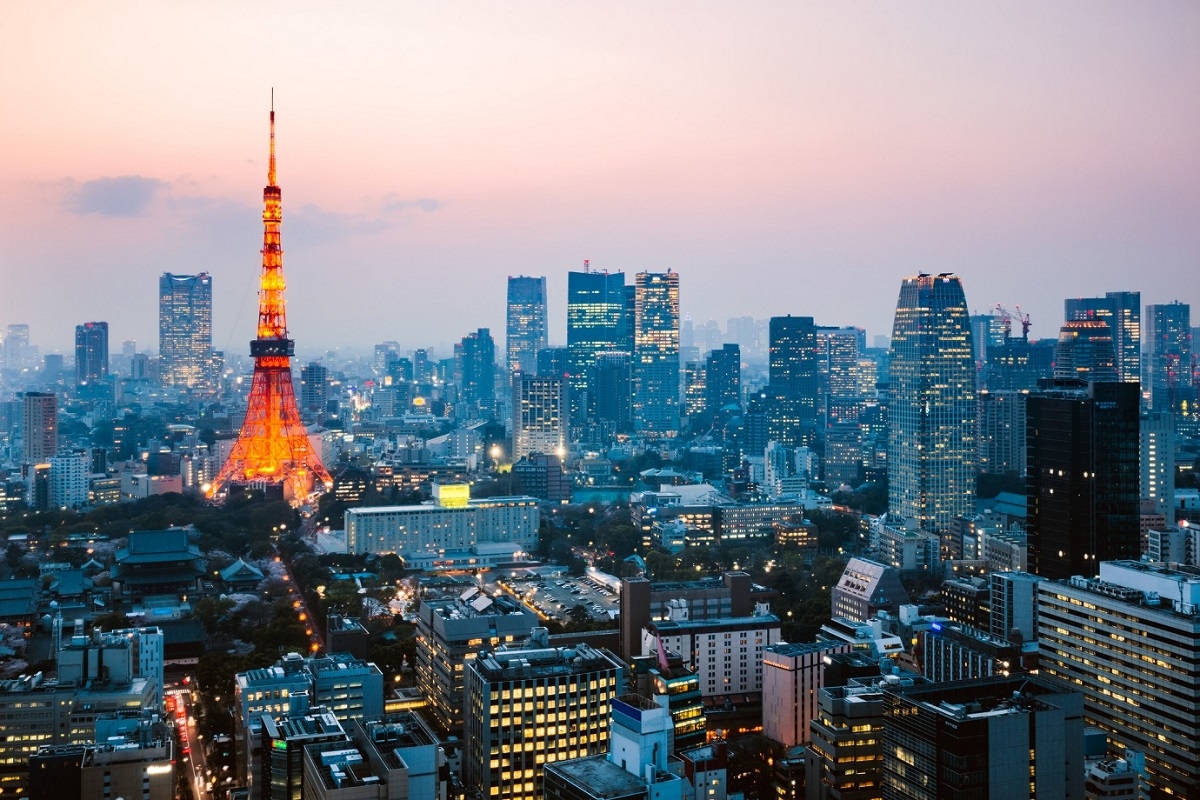 A view of Tokyo Tower and the surrounding cityscape at dusk.