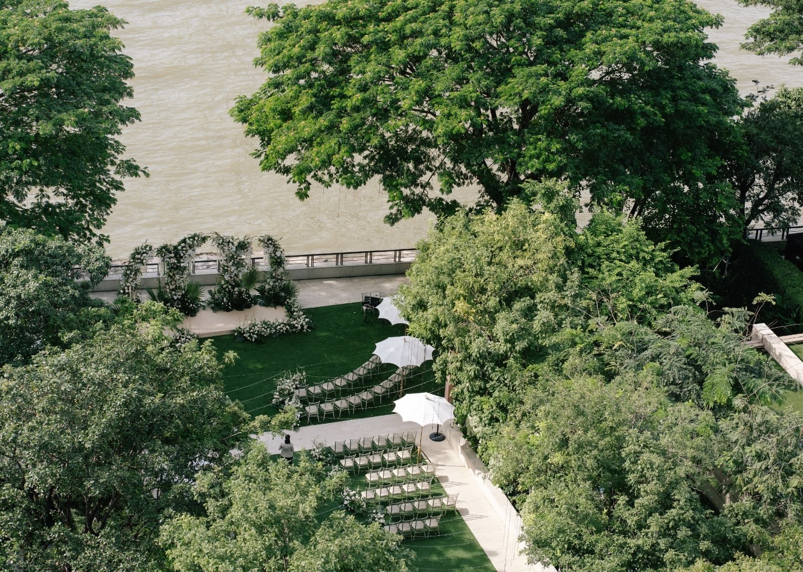 ceremony in front of the Chao Praya River, which provides a stunning backdrop for weddings at Capella Bangkok.