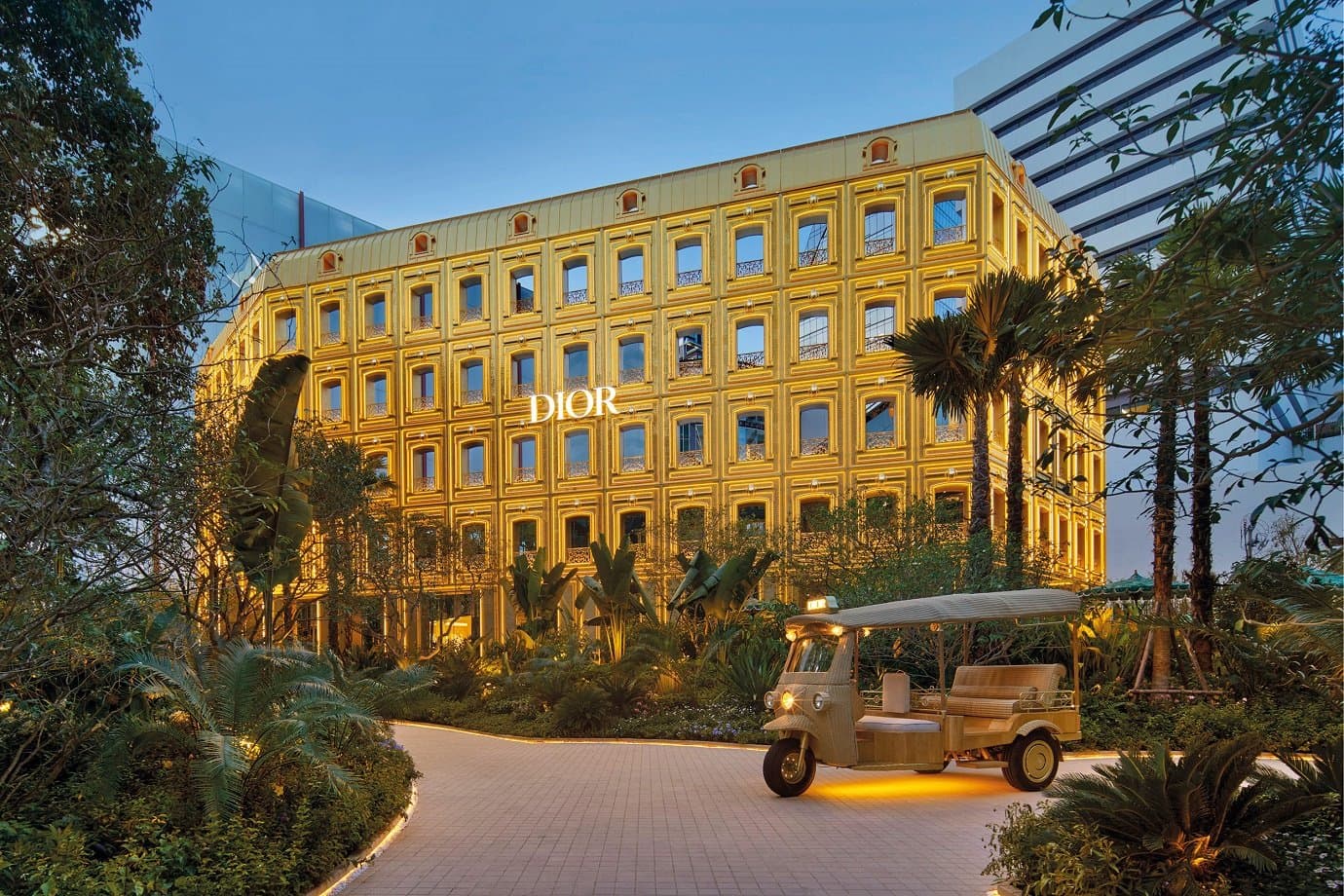 The golden-tiled facade of Dior Gold House in Bangkok.