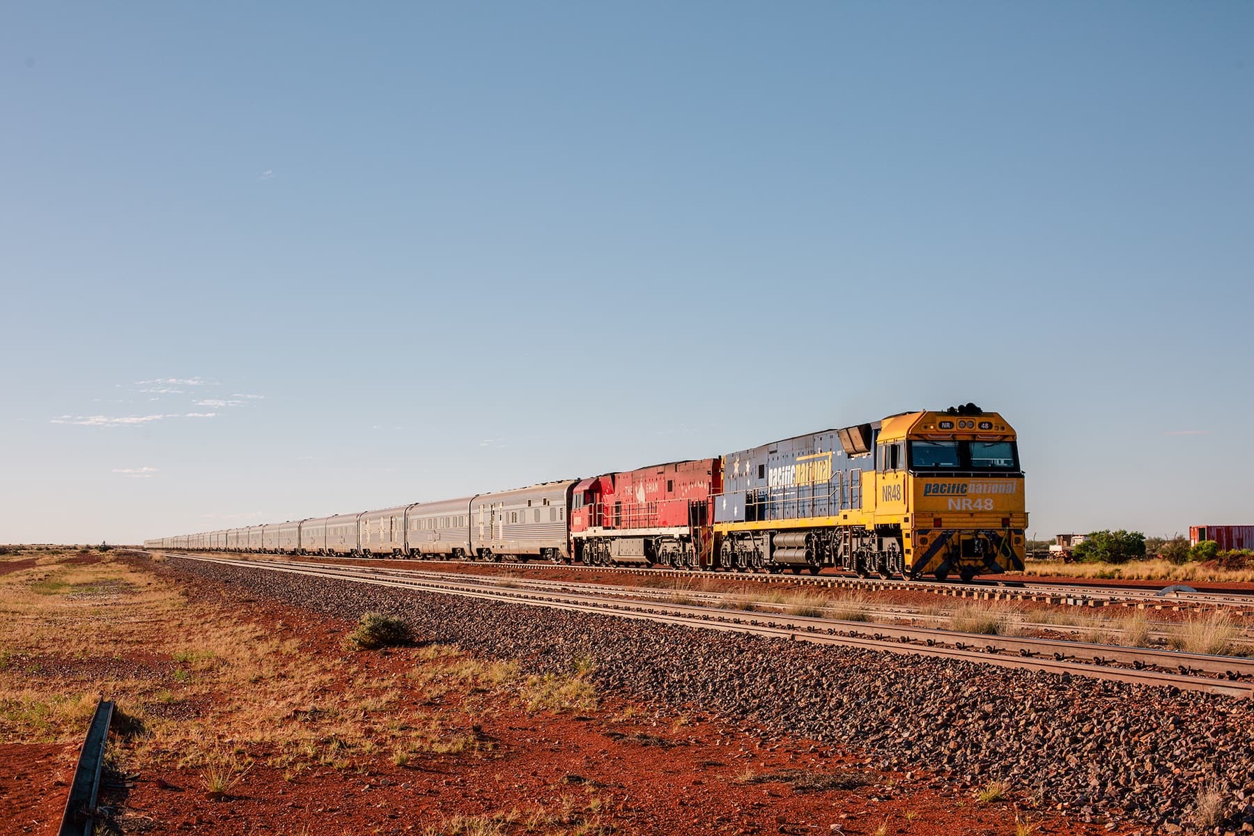 The Ghan at Manguri in the outback of South Australia, with three dozen gleaming stainless-steel carriages headed by two locomotives.