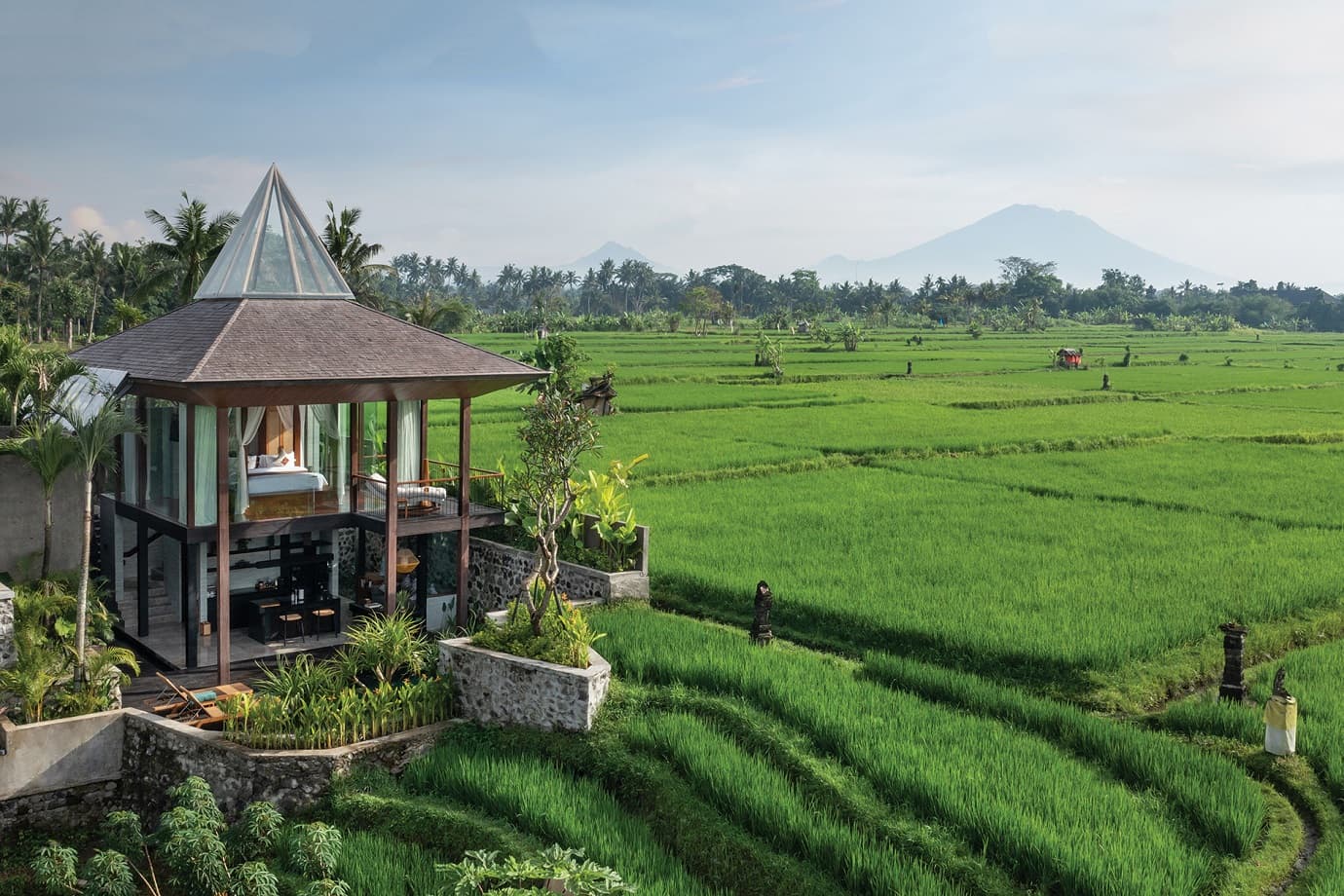A two-story pool villa at Gdas Bali overlooks the paddy fields of Ubud’s Mas village.